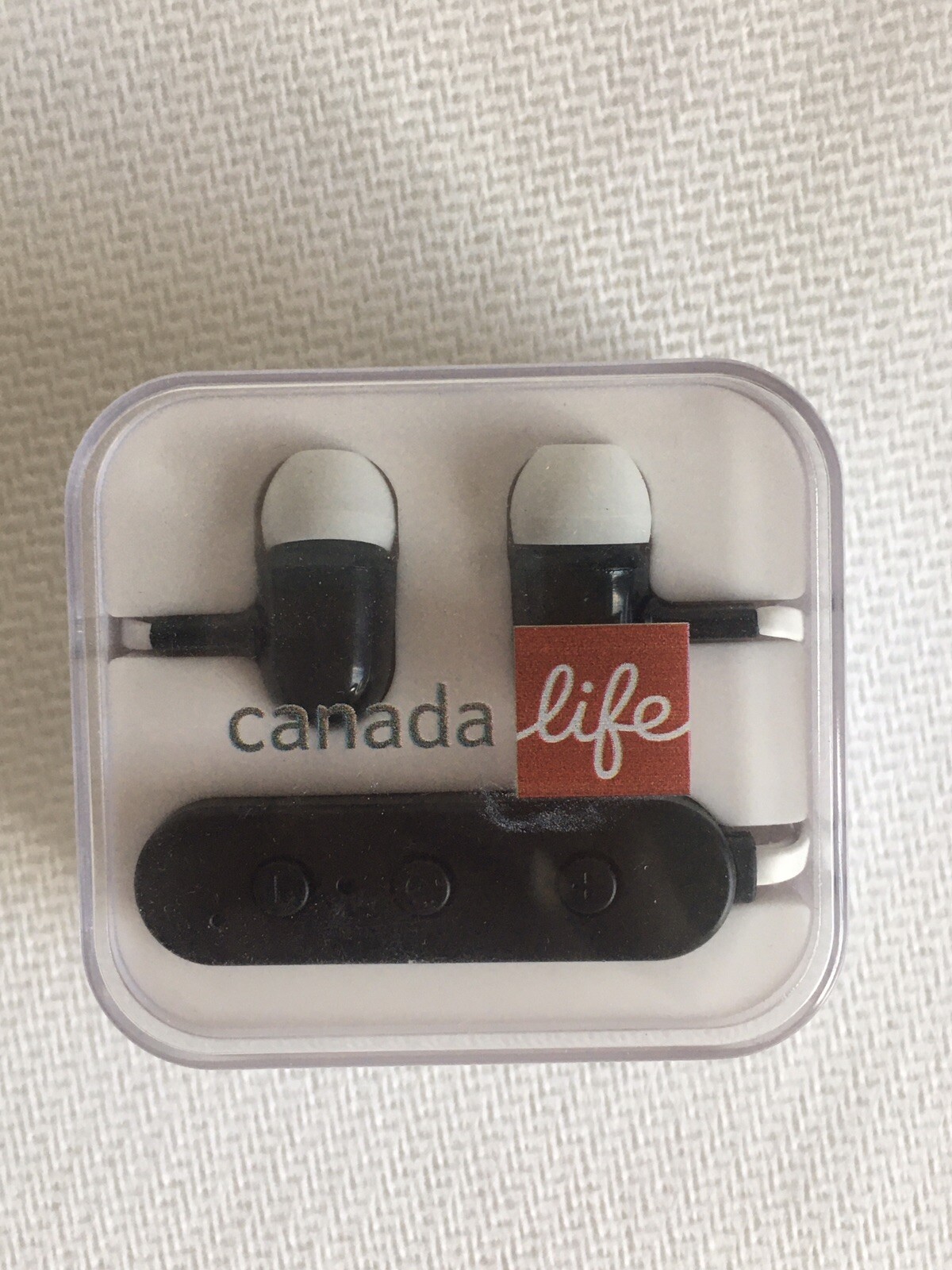 brand new, open box canada life bluetooth black/white earbuds headphones case