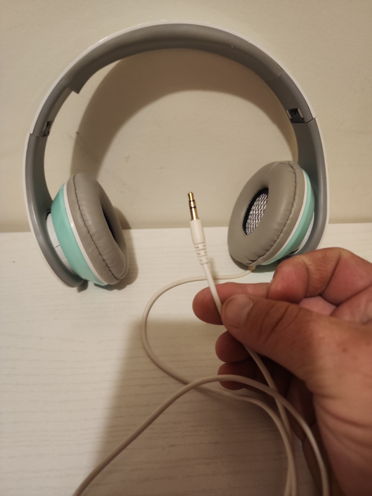 kids mint green corded headphones