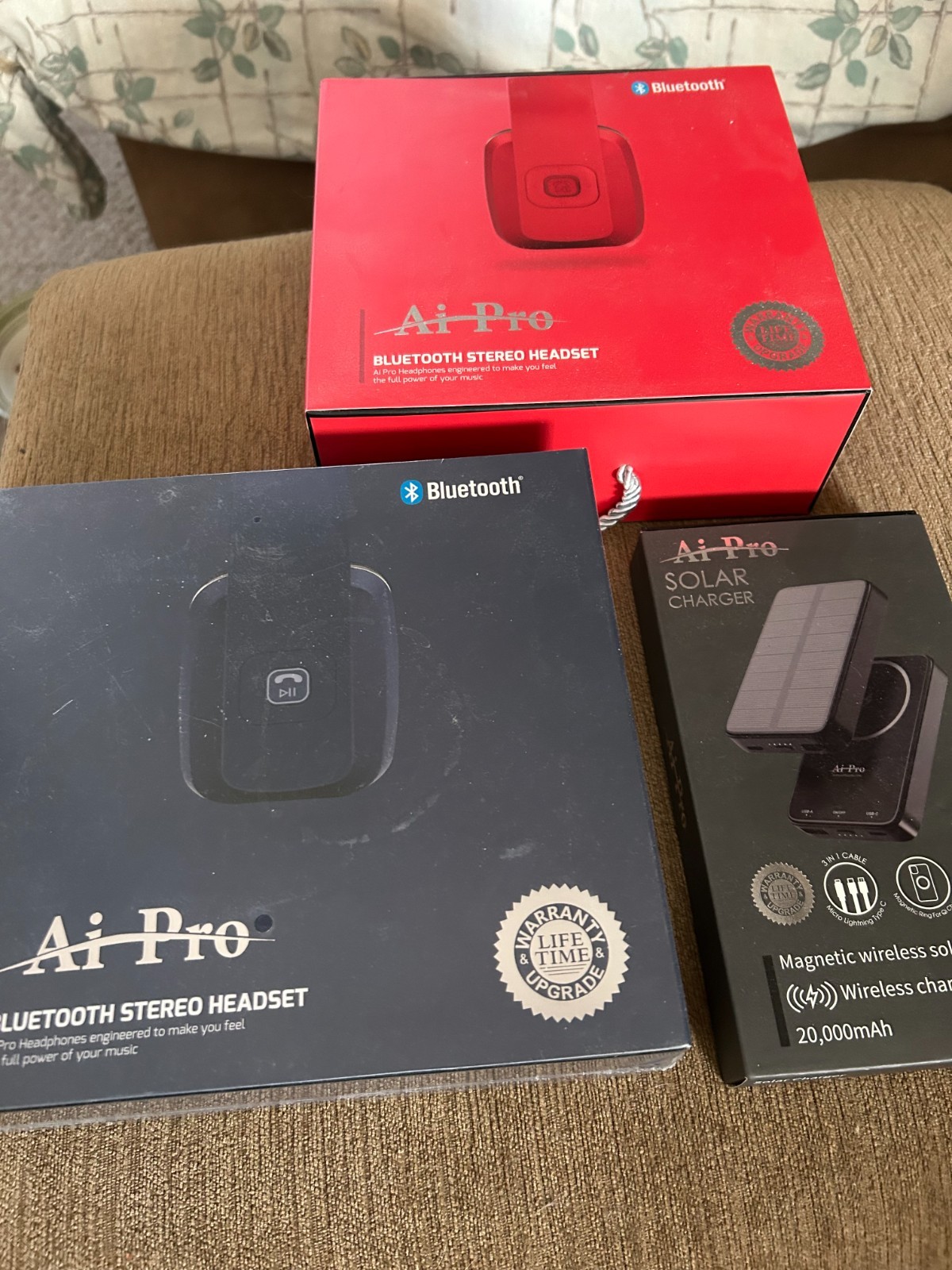 2 pair Ai Pro-100 Plus Bluetooth Headphones – Brand New and solar charger