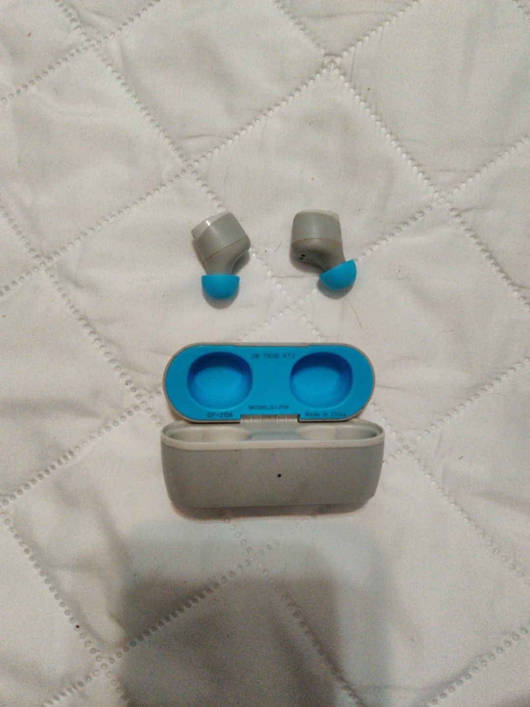 Skullcandy Jib True 2 Wireless In-Ear Earbuds in light gray and blue.