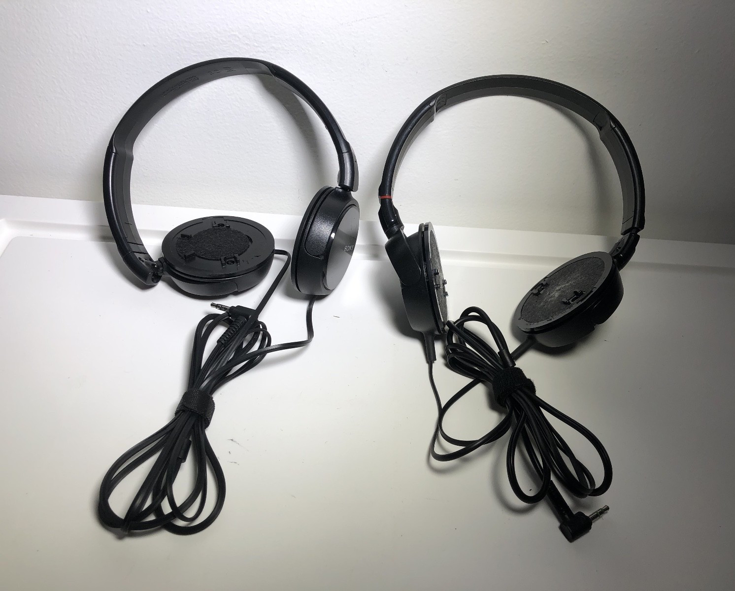 Lot of 2 Sony Stereo Headphones (no cushioning) – MDR-ZX100 and unknown Model