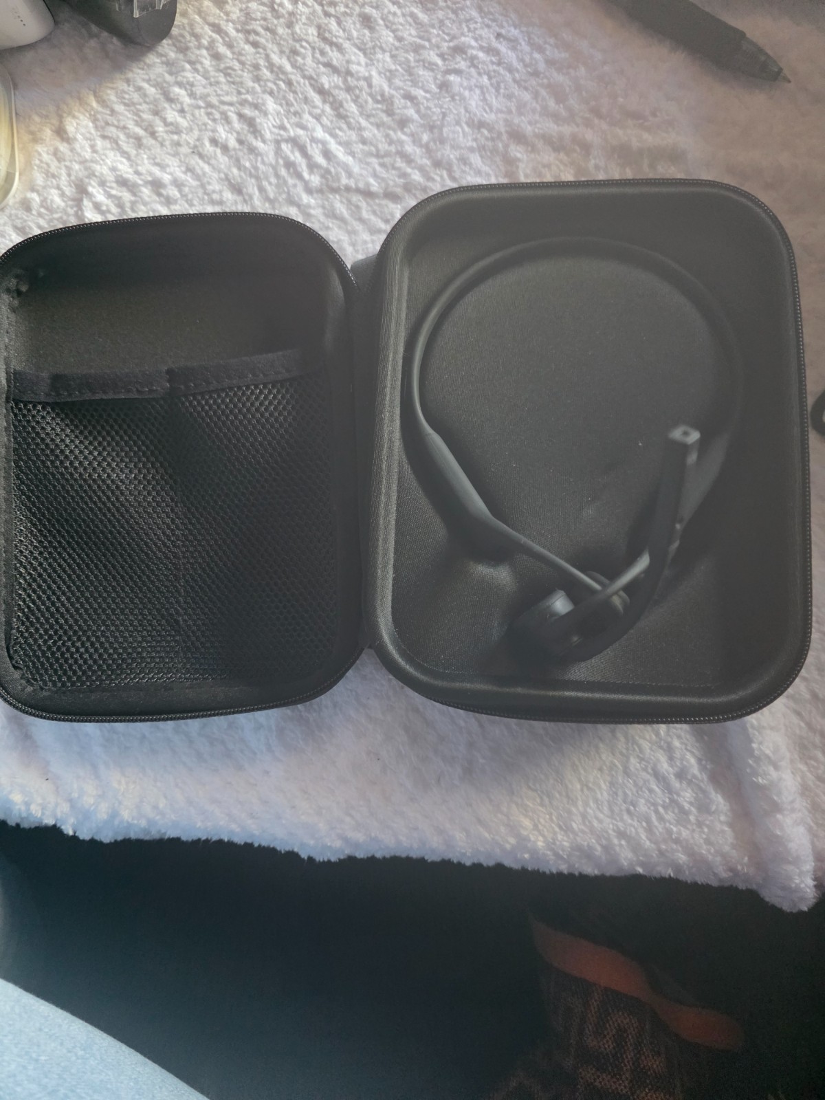shok open comm black Bluetooth wireless in their protective case