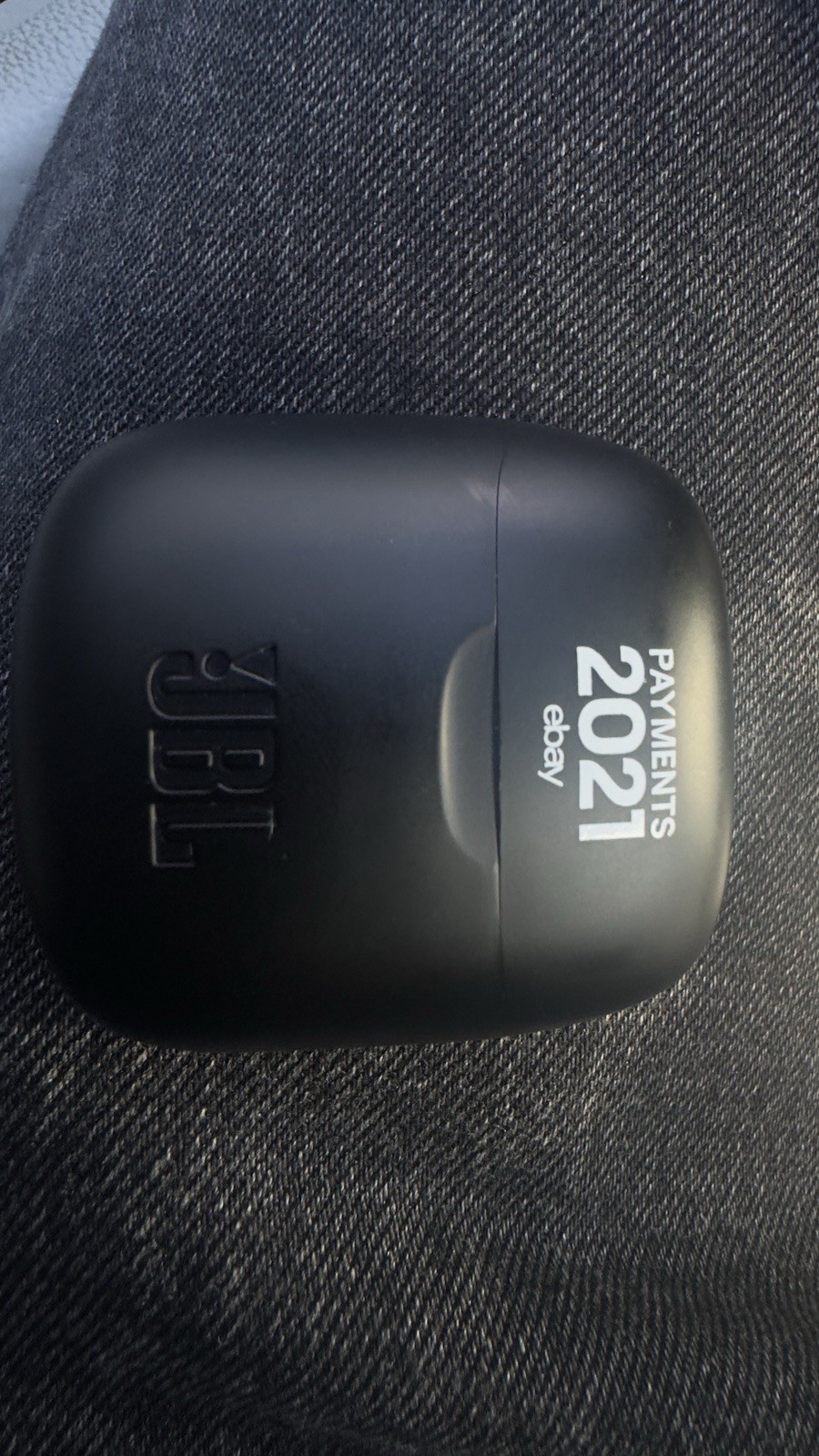 This is JBL wireless earbuds in a black charging case featuring a custom
