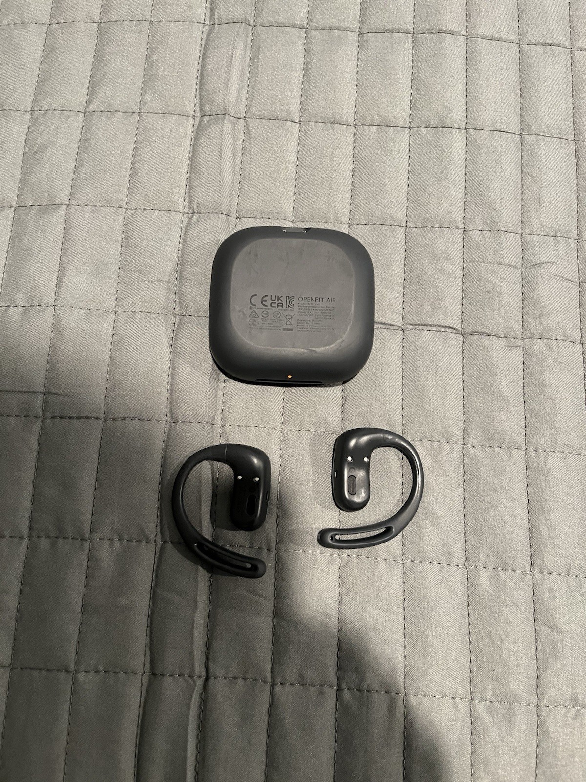 Shokz OpenFit True Wireless Open-Ear Bluetooth Earbuds with charging case black.