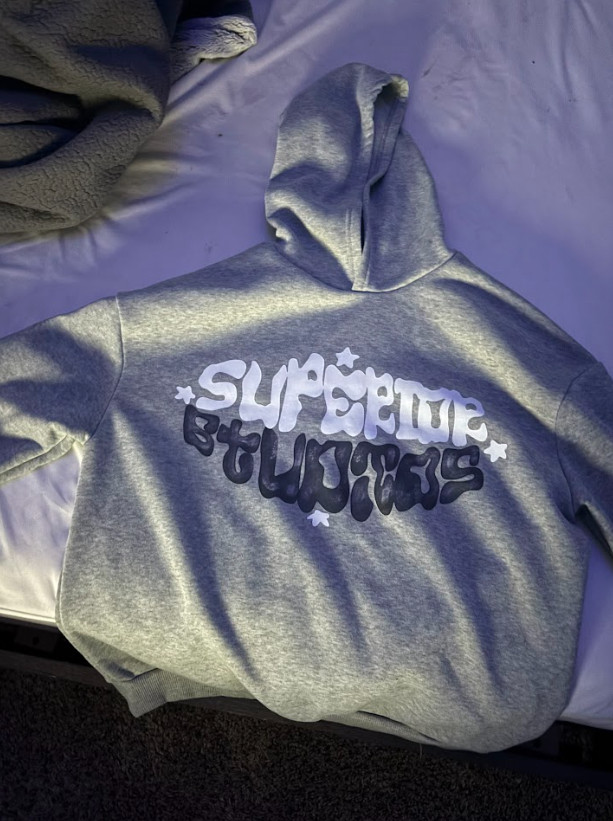 grey hoodie with black and white design size is a medium in men’s sleeve design