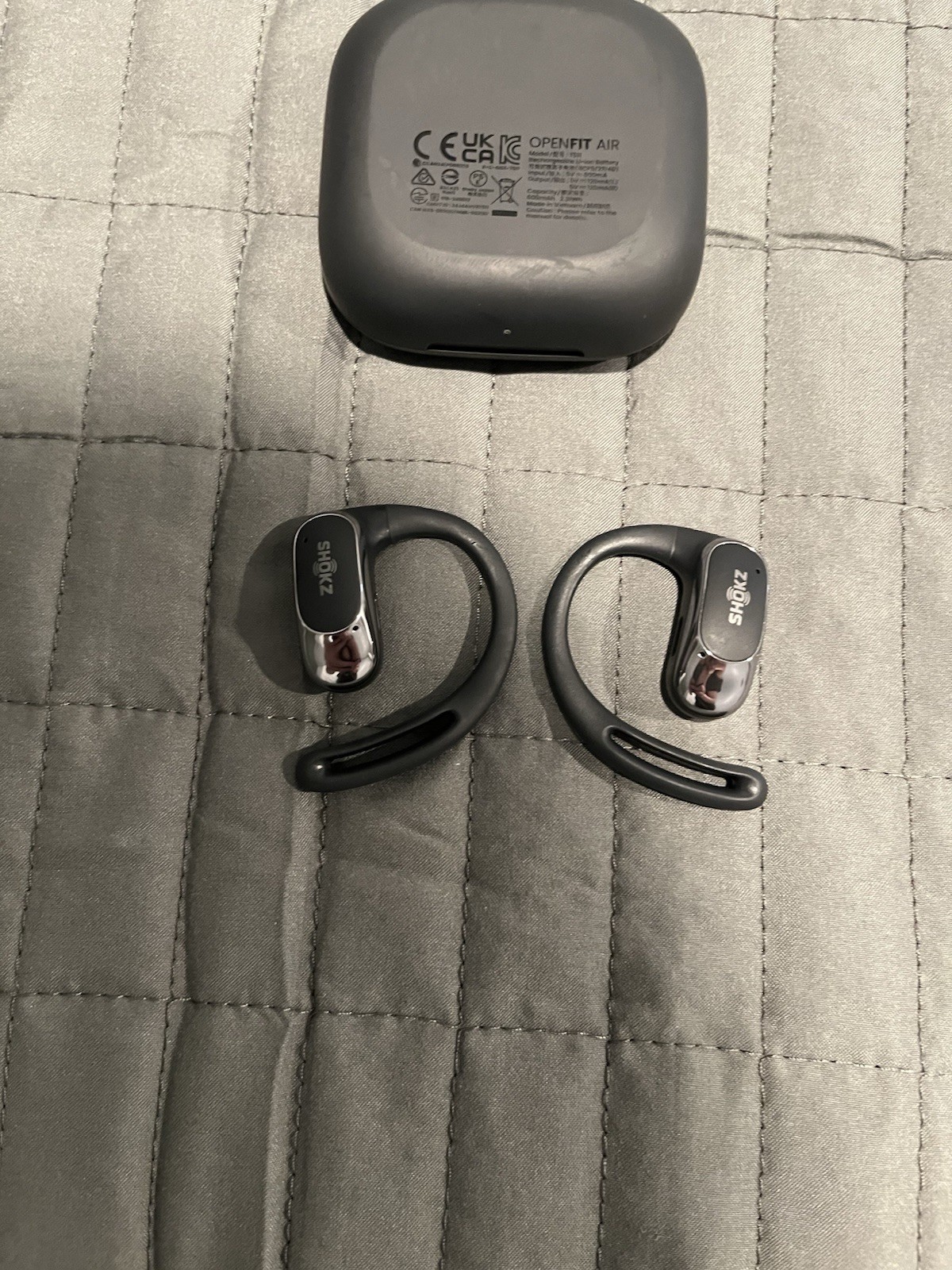 Shokz OpenFit True Wireless Open-Ear Bluetooth Earbuds with charging case black.
