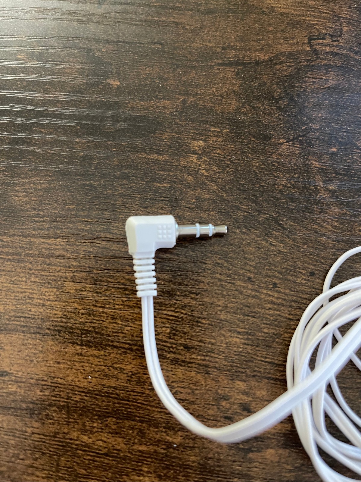 Unbranded White and Red Wired Earbuds with a 3.5 mm Angled Audio Jack Connector
