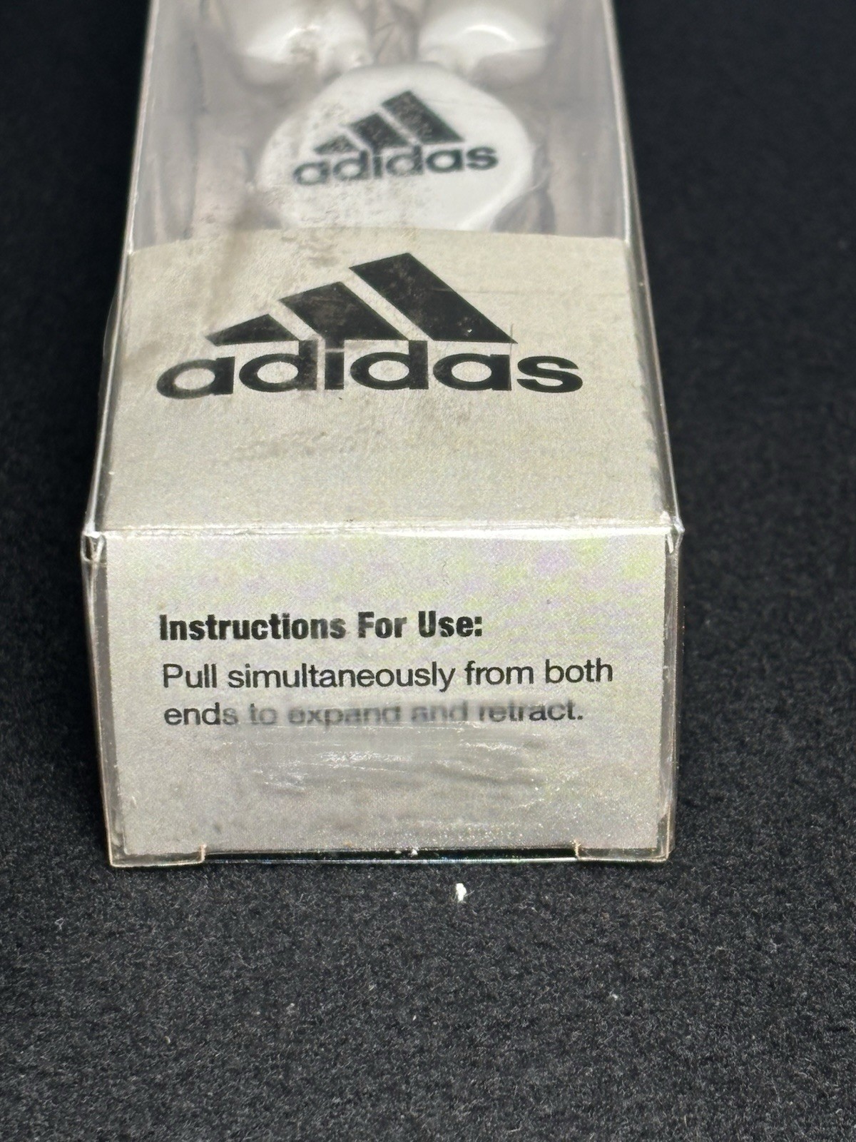 Adidas branded item is a pair of retractable wired earphones New In Box