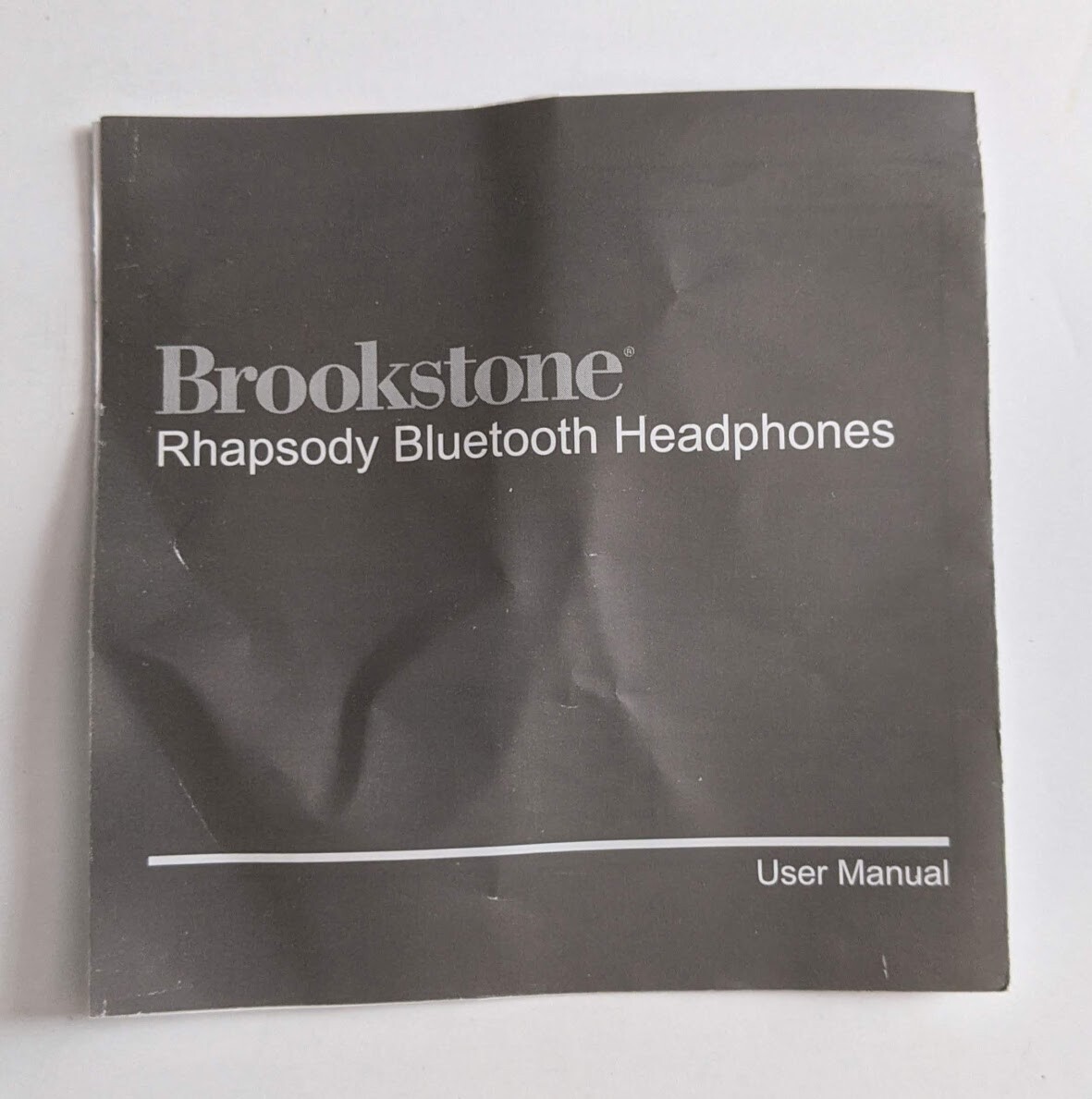 Brookstone Rhapsody Bluetooth Headphones Unused in Box w Cords USB Storage Bag