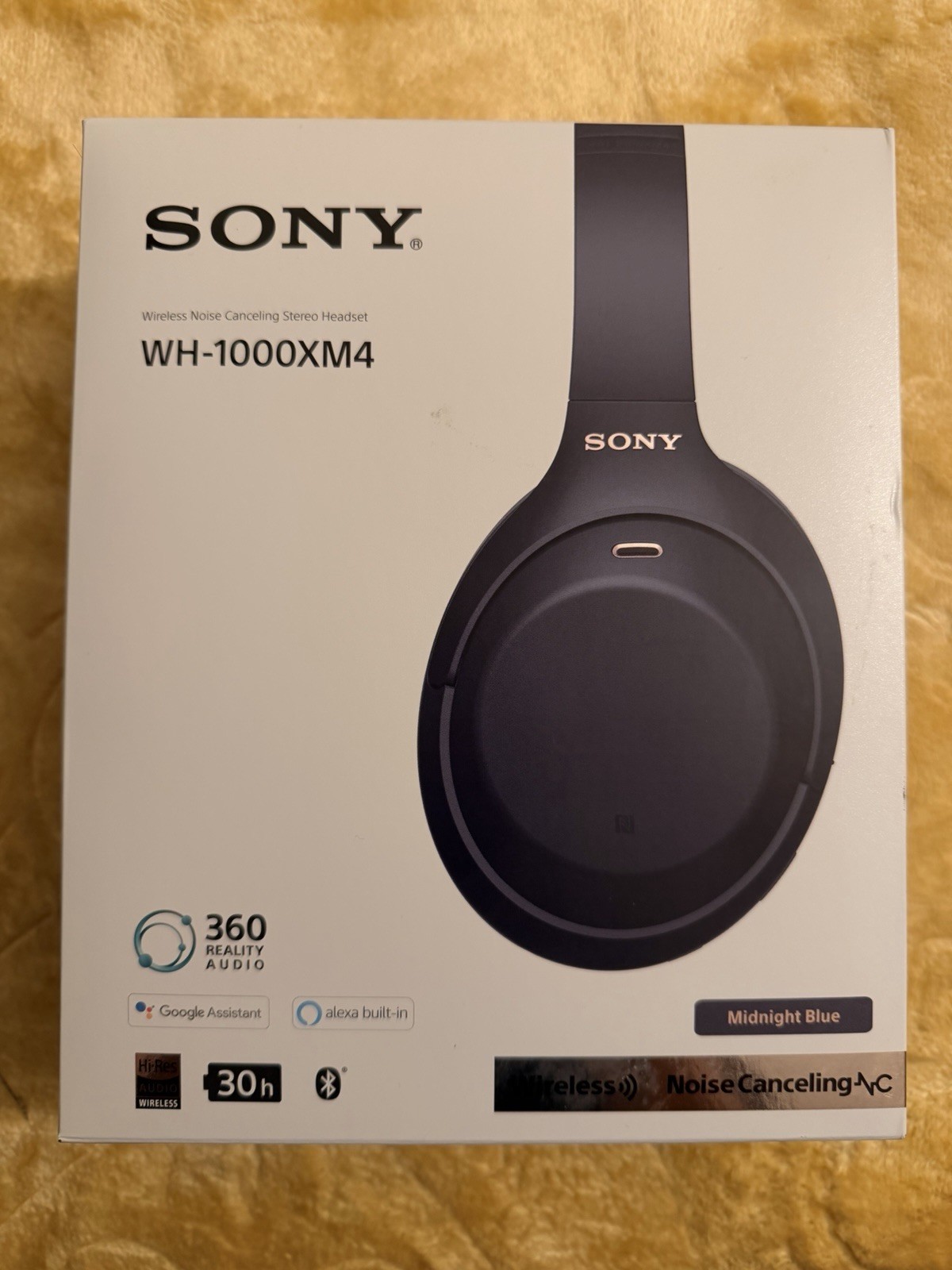 Sony WH-1000XM4 wireless noise cancelling headphones in Midnight Blue.