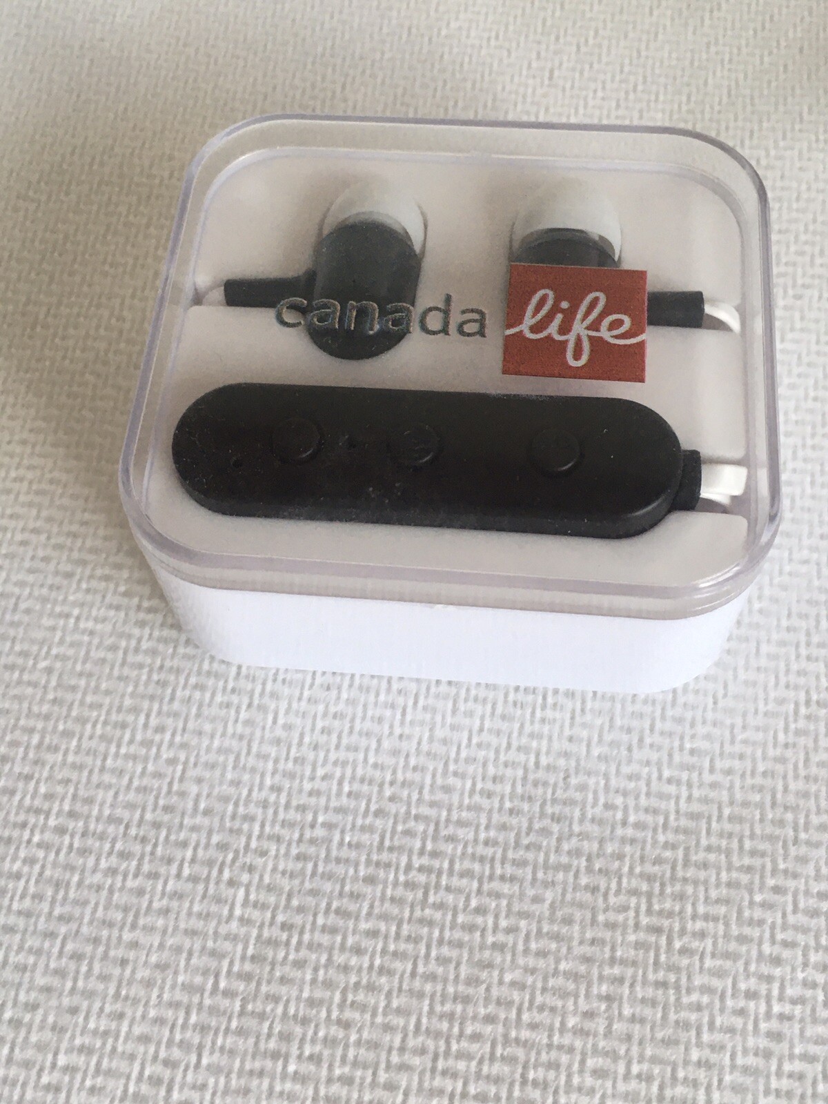 brand new, open box canada life bluetooth black/white earbuds headphones case
