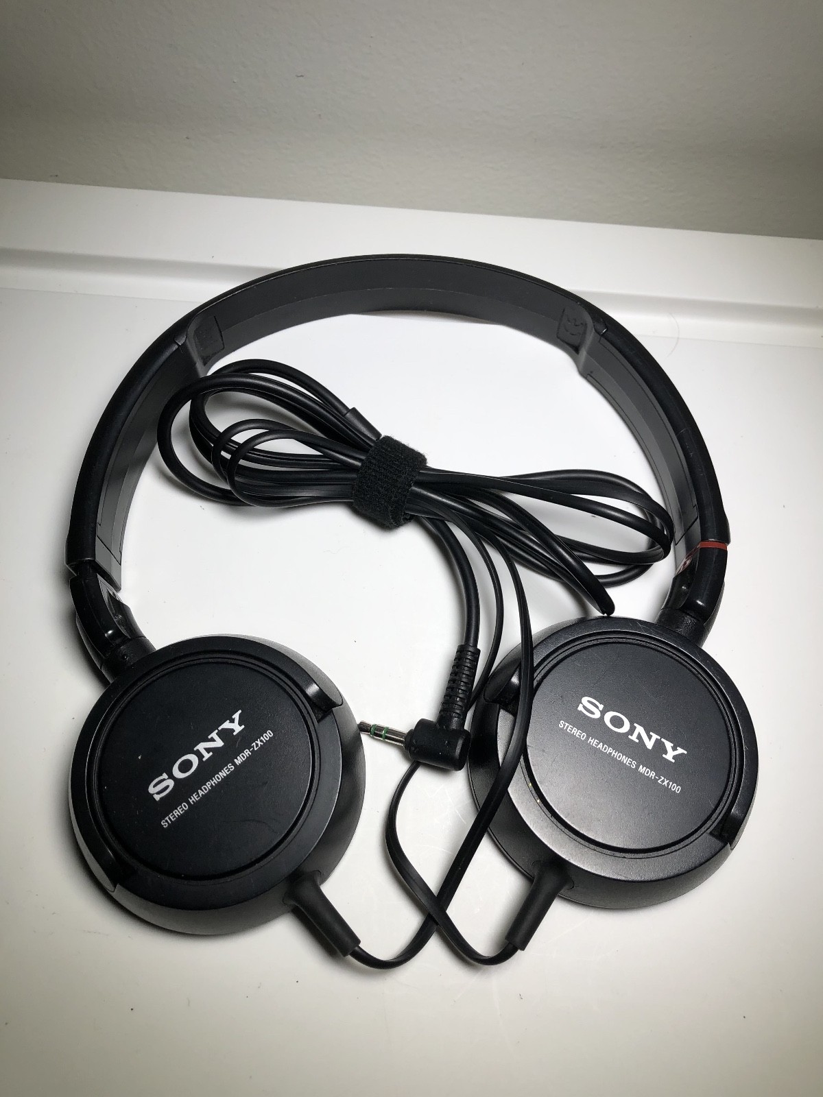 Lot of 2 Sony Stereo Headphones (no cushioning) – MDR-ZX100 and unknown Model