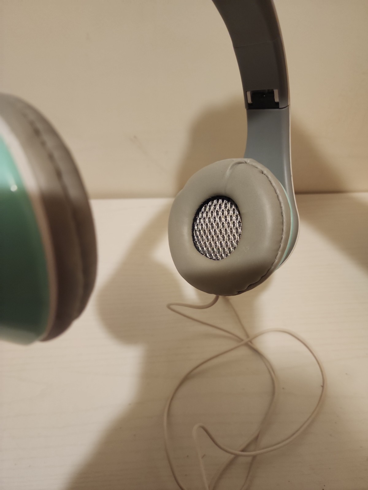 kids mint green corded headphones
