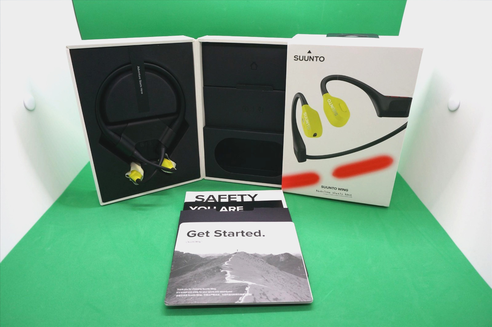 Suunto Wing Bone Conduct Headphones in Lime with flashing Red safety light IP67
