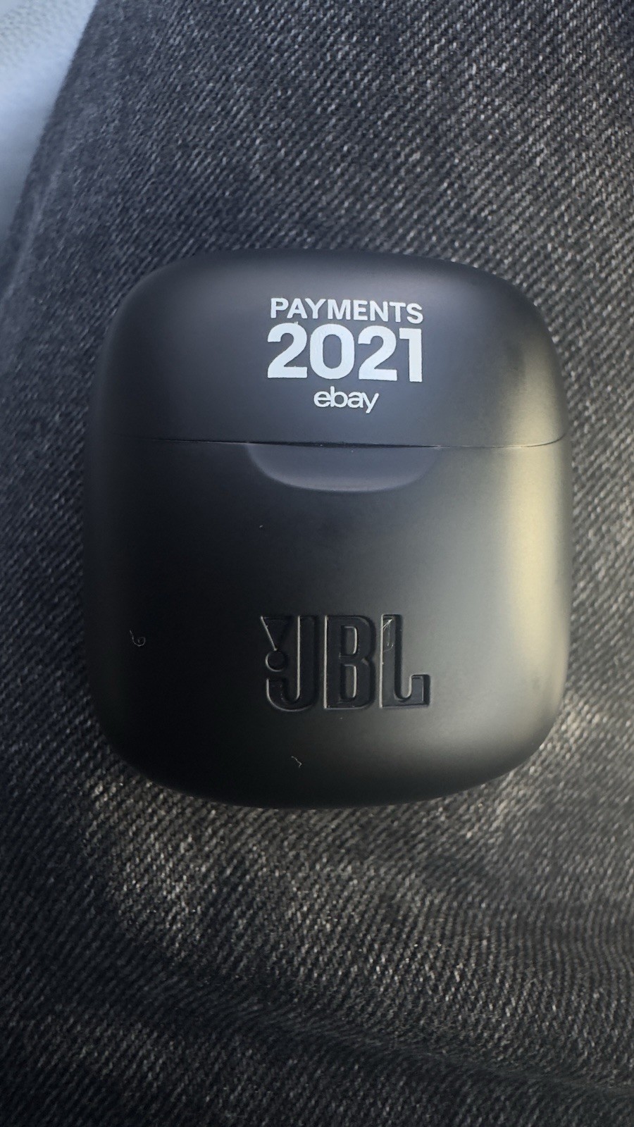 This is JBL wireless earbuds in a black charging case featuring a custom