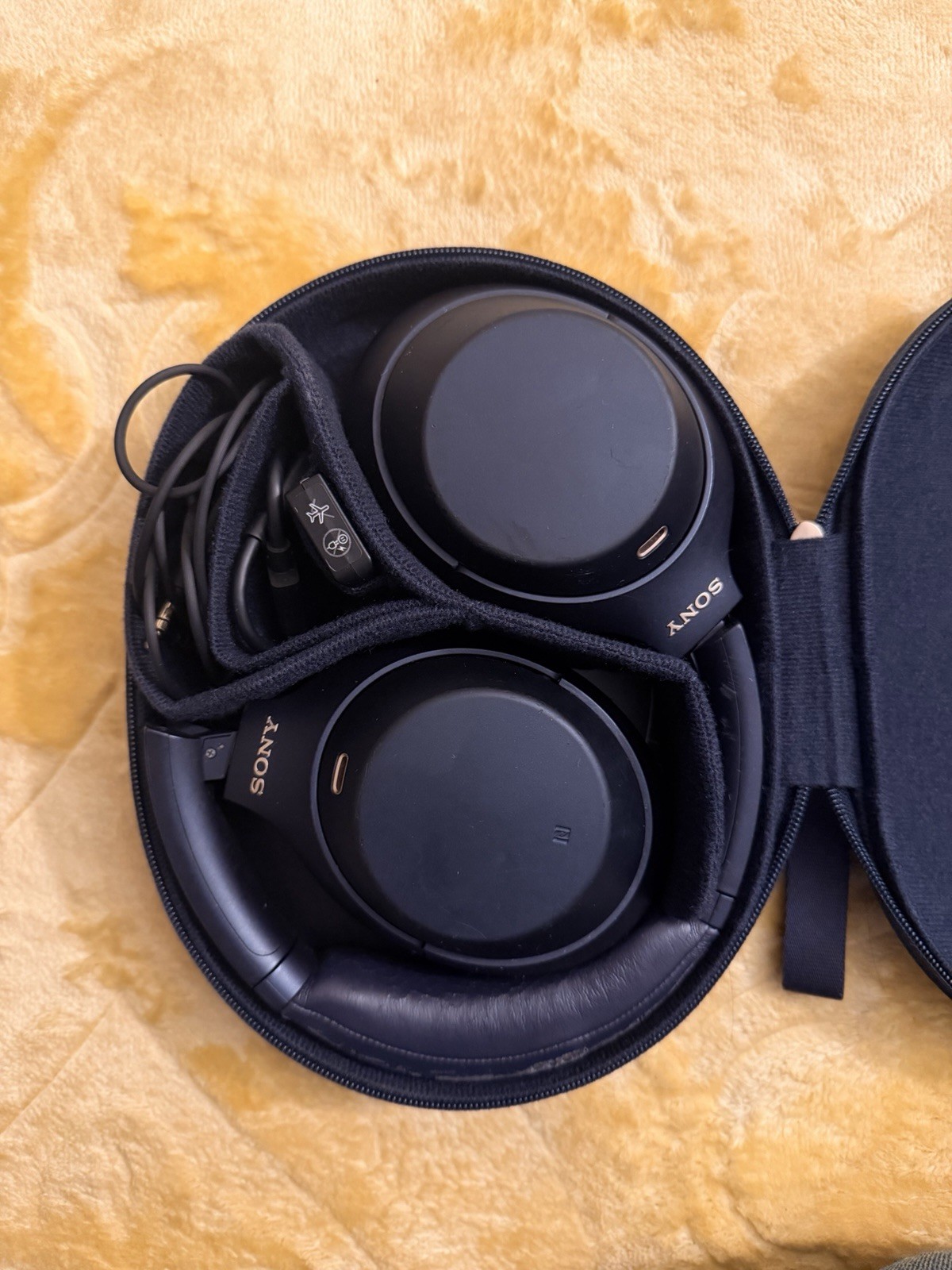 Sony WH-1000XM4 wireless noise cancelling headphones in Midnight Blue.