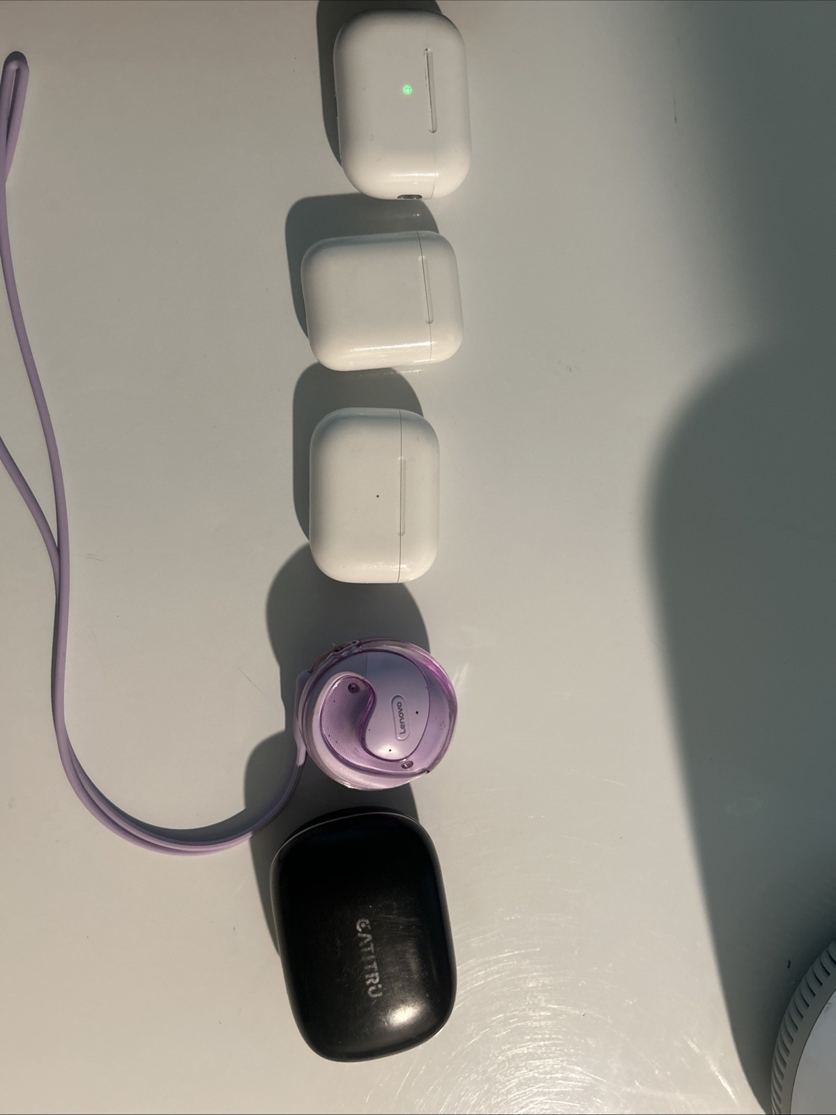 A Collection of Earbuds with Three AirPods Pro and Other Branded Headphones