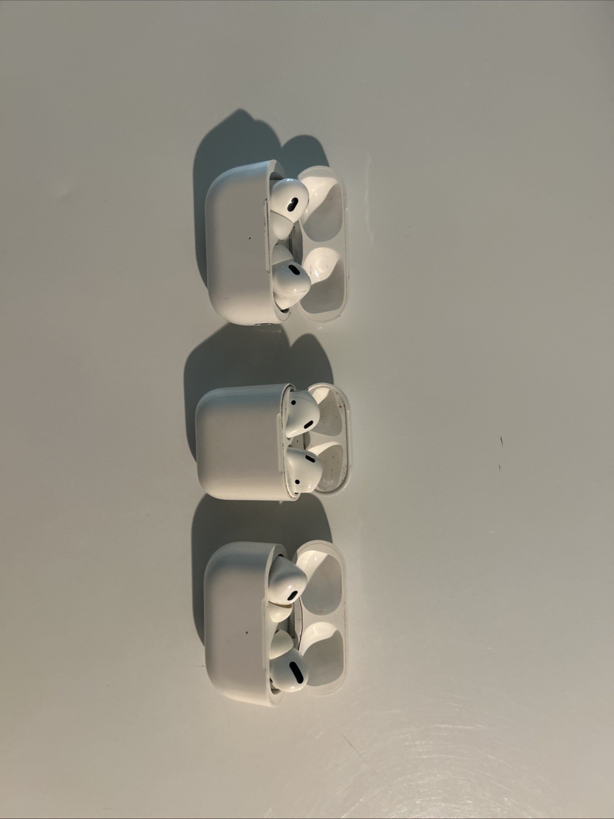 A Collection of Earbuds with Three AirPods Pro and Other Branded Headphones