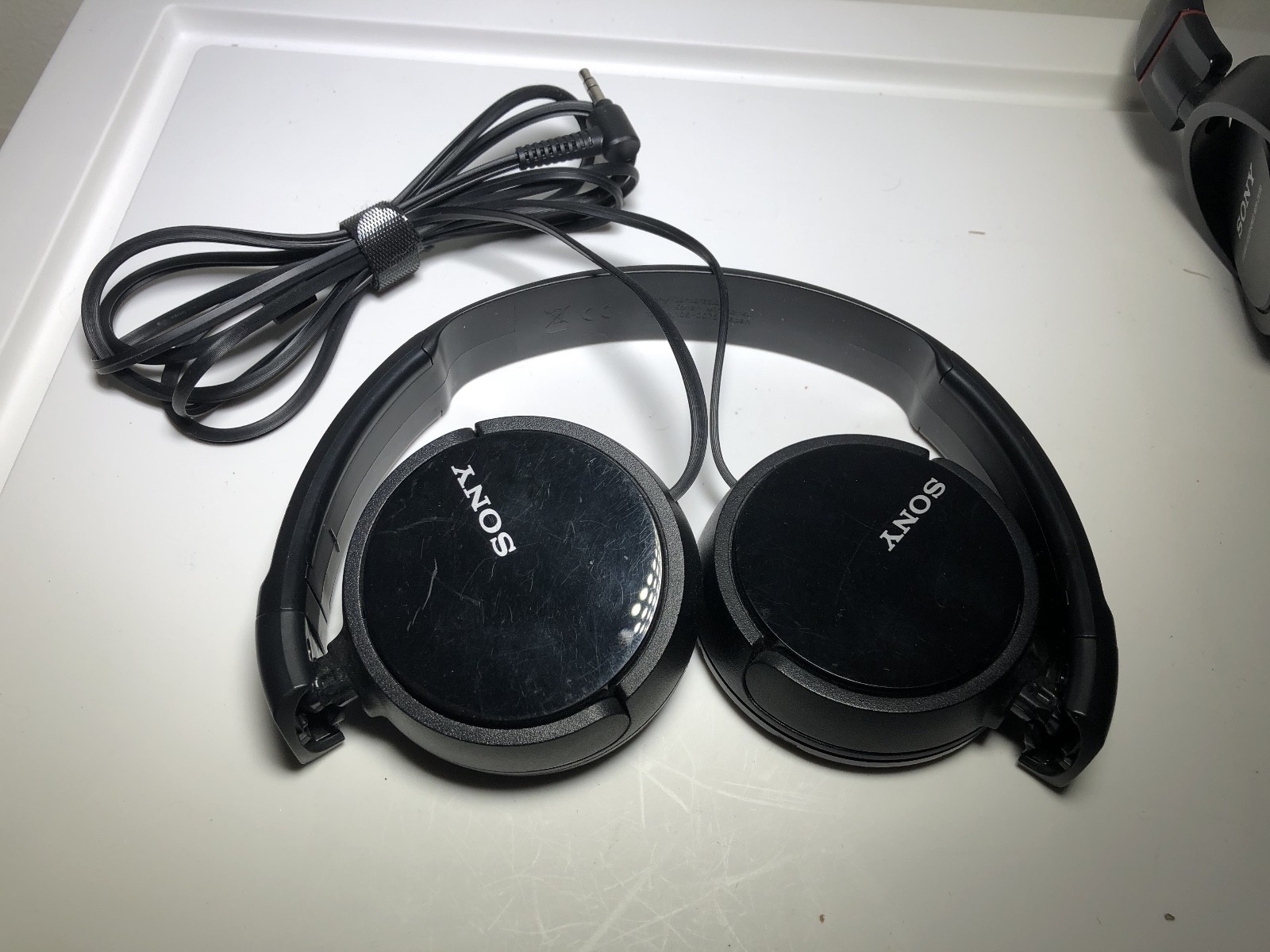 Lot of 2 Sony Stereo Headphones (no cushioning) – MDR-ZX100 and unknown Model