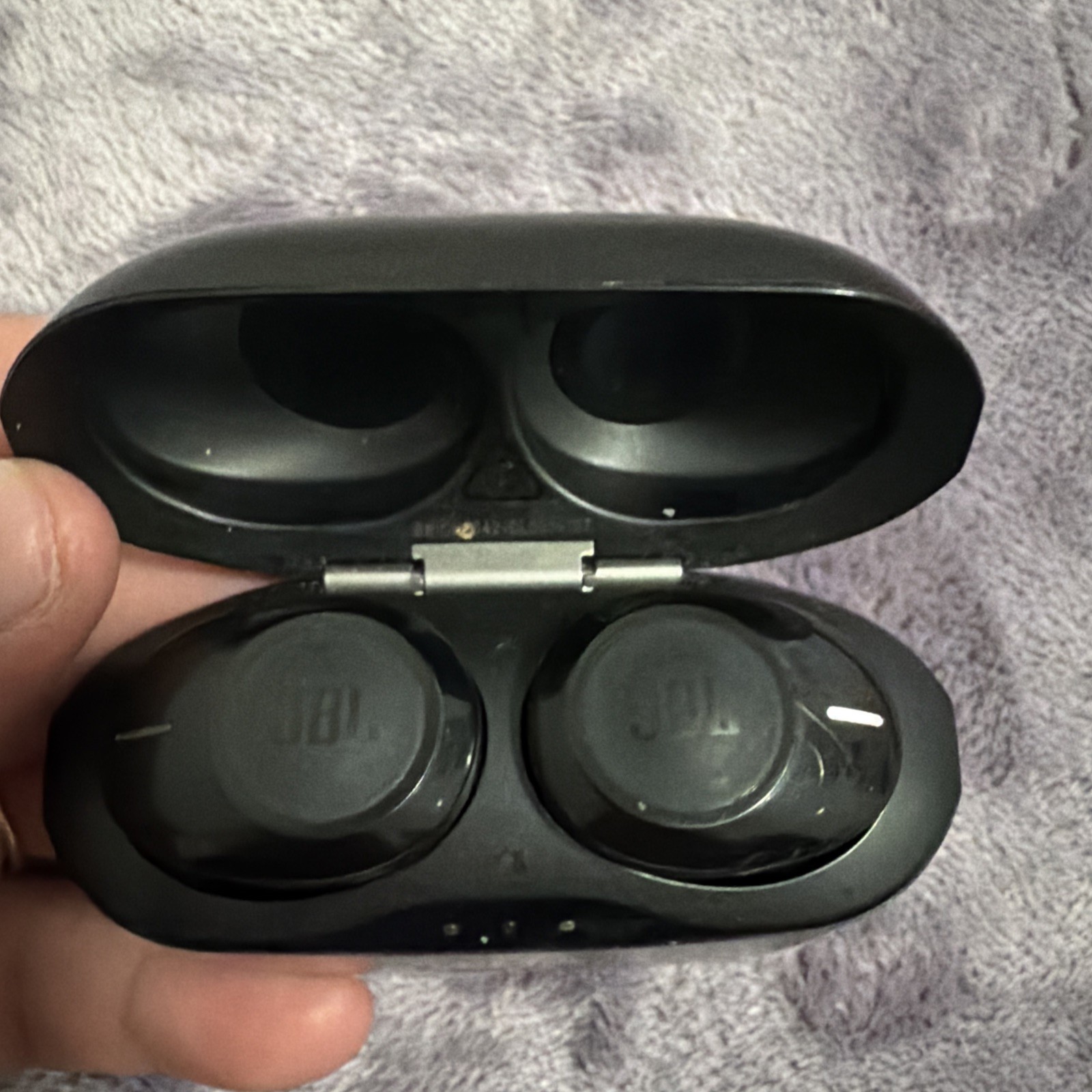 Black JBL Earbuds Bluetooth Wir. With Case and it has a charger.