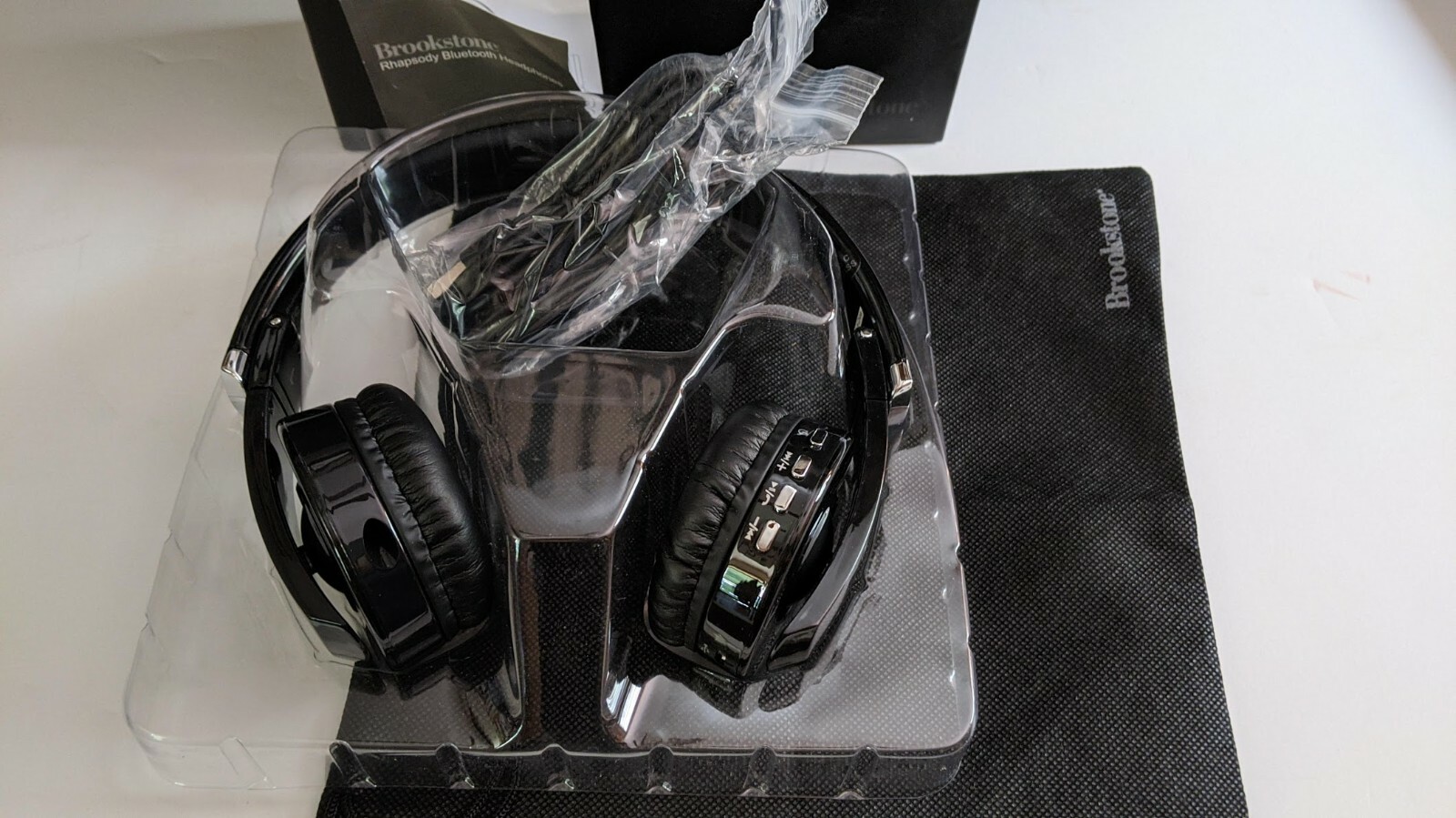 Brookstone Rhapsody Bluetooth Headphones Unused in Box w Cords USB Storage Bag